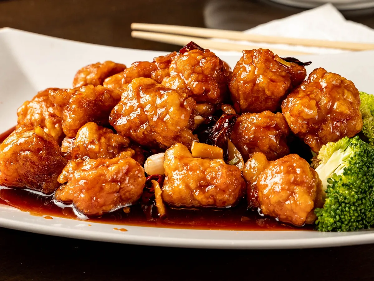 Braised spicy crispy chicken chunks with rich glossy sauce at Osaka Sushi & Hibachi & Asian Bistro & All You Can Eat, an Asian Restaurant in Bloomfield