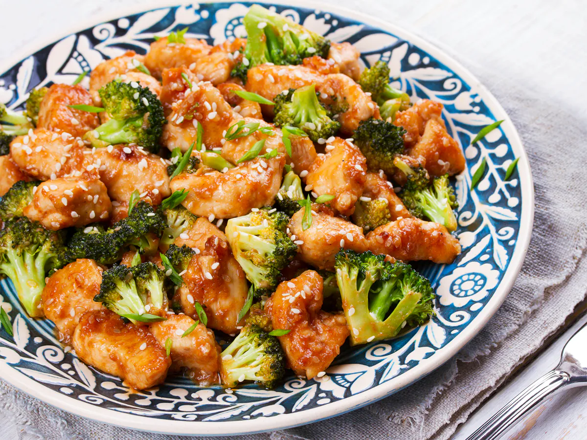 Glazed sesame chicken stir-fried with crisp broccoli florets at Osaka Sushi & Hibachi & Asian Bistro & All You Can Eat, an Asian Restaurant in Bloomfield