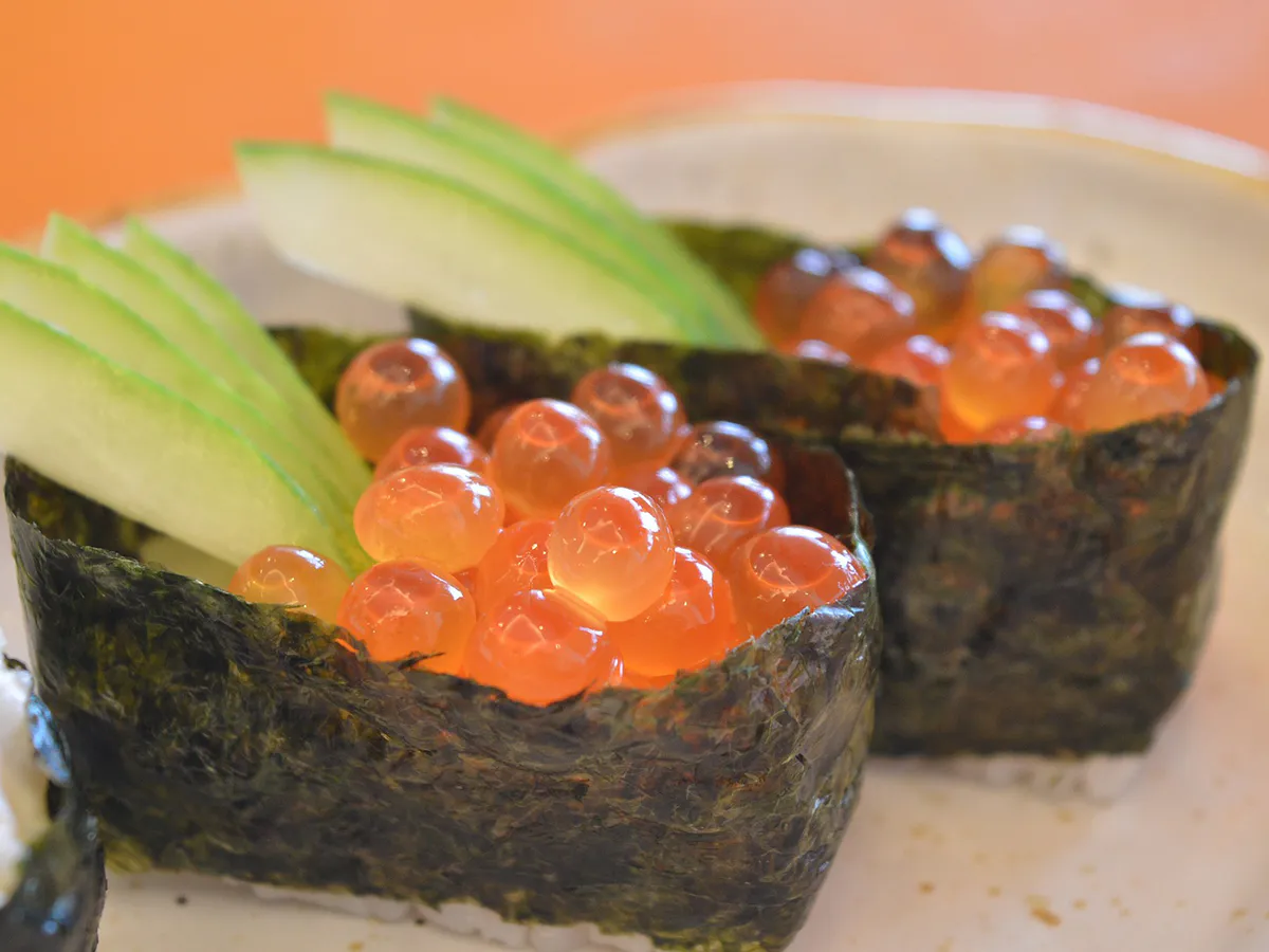 Salmon roe gunkan sushi with crisp cucumber slices at Osaka Sushi & Hibachi & Asian Bistro & All You Can Eat, an Asian Restaurant in Bloomfield