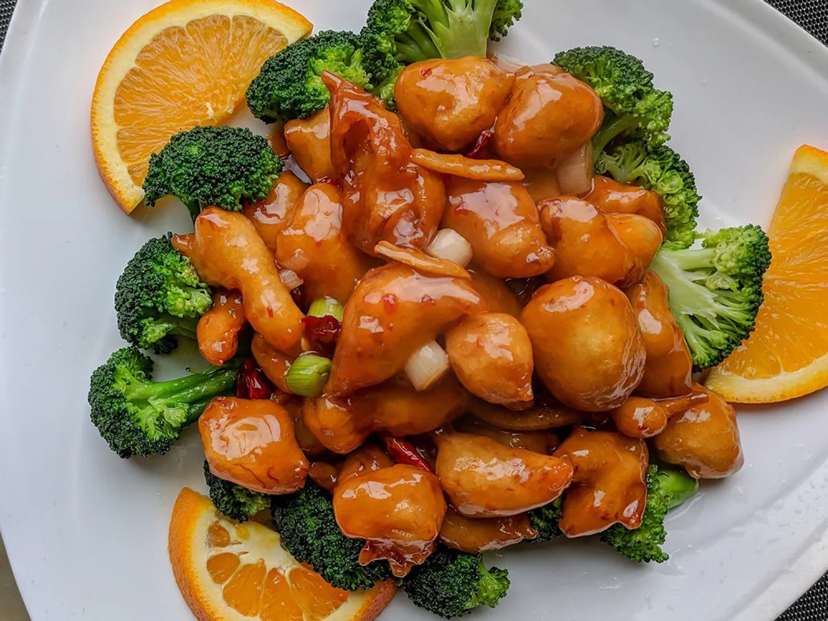 Sweet orange glazed chicken with fresh broccoli and orange slices at Osaka Sushi & Hibachi & Asian Bistro & All You Can Eat, an Asian Restaurant in Bloomfield